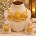 Stile Sovrano gold-toned necklace and matching jhumka earrings displayed on a jewellery bust